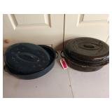 Set of two enamel turkey roasters, one blue one
