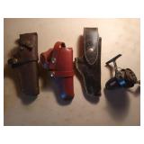 3 pistol holsters, fishing reel