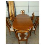 Mixed wood dining table w/ 8 chairs, 2 being