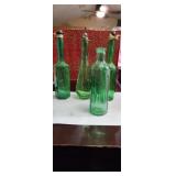 Lot of pretty green bottles various sizes and