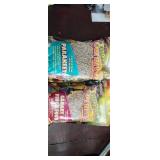 Brand new bags of bird food make your cheeps