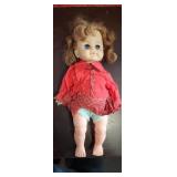 antique doll with pretty blue eyes and red curly