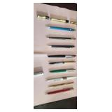 Vintage pens and pencils with cross and a