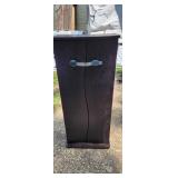 Small thin tall cabinet with child lock on it