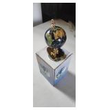 beautiful small world globe made with gemstones