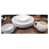 lot of white dishes 4 plates 1 shallow bowl 1