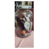 a gallon jar of bits and bobs and sparkly things