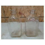 2 glass milk bottles