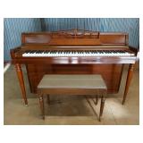 Beautiful Wurlitzer piano w/ bench, has area of