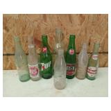 Glass bottle collection, mostly soda brands