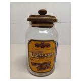 Glass olde Thompson cracker jar with wood lid 8"