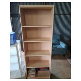 Blonde colored bookshelf with five shelves, and