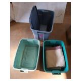 Three tubs, only one has a lid, and a blanket