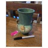Old green Roseville vase