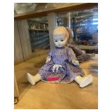 Ceramic baby doll in cute blue dress.. arms,
