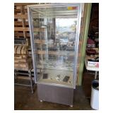 Glass display case on wheels with 4 shelfs  66 x
