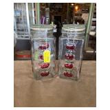 Glass storage jars with hinged lids and painted
