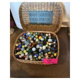 Collection of marbles in a wicker basket