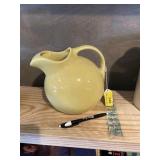 Hall USA  pottery round  yellow pitcher.. chip on