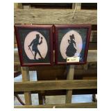 Two framed silhouette pictures, male and female