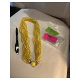 Vintage yellow string plastic beaded necklace