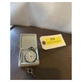 Antique pocket watch with key