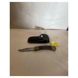 Buck knife, 110 in black leather case 4 inch