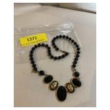 Decorative black plastic bead necklace