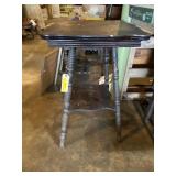 Old wood table with spindle legs and bottom shelf