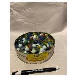 Tin of assorted marbles