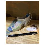 Rare iridescent ceramic shoe figurine, occupied