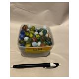 Plastic container of marbles