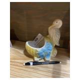 Vintage planter stork and baby basket.