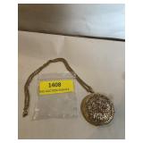 Gold tone, locket necklace