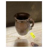 Brown pottery water pitcher 6 inches tall