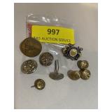 Collection of military buttons and pins