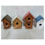 Set of four handmade plywood birdhouses with