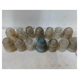 Collection of 14 glass insulators, some are