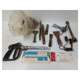 Smorgasbord of hinges, palette knives, chainsaw