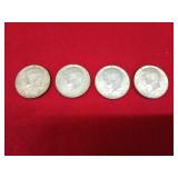 Four 1964 Kennedy half dollars