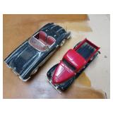 Pair of red-and-black diecast models, one is a 58