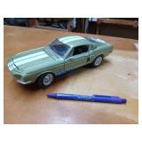 Green diecast model of a 68 Ford Shelby GT