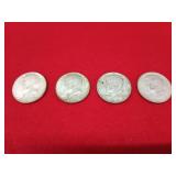 Four 1964 Kennedy half dollars