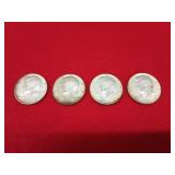 Four 1964 Kennedy half dollars