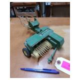 Ertl diecast model of a John Deere square hay
