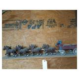 Cast iron horse drawn wagon, has some damage,