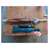 Three assorted sizes umbrellas