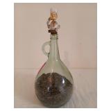 Glass bottle with wooden stopper