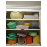 Cabinet of assorted Tupperware