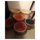 Six assorted flower pots, one is terracotta